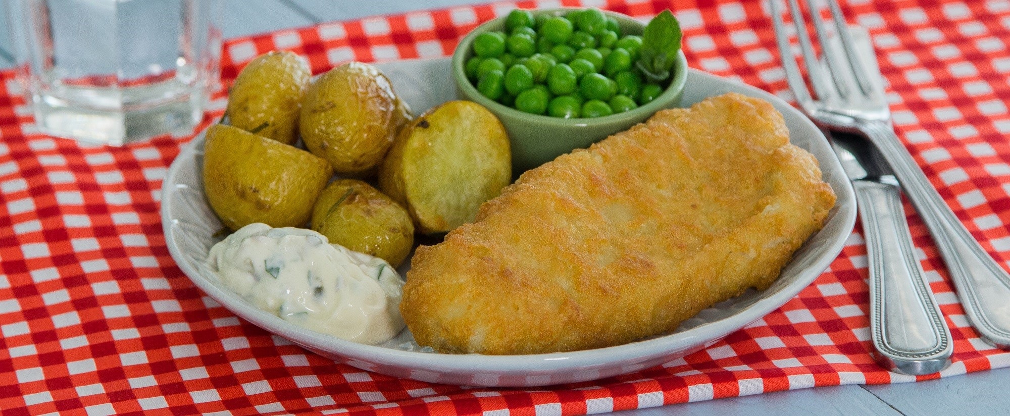 Battered Cod Fillets with rosemary and sea salt mini roasted potatoes and a side of peas